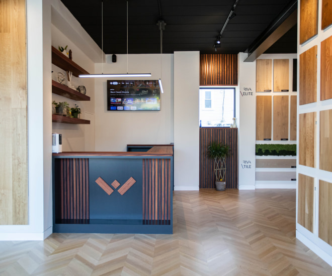 Weles showroom interior featuring a reception desk and modern furnishings.