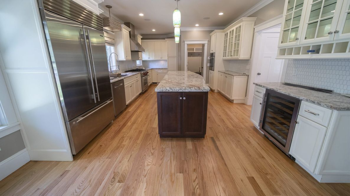 Refinished plain sawn red oak in a Wellesley kitchen